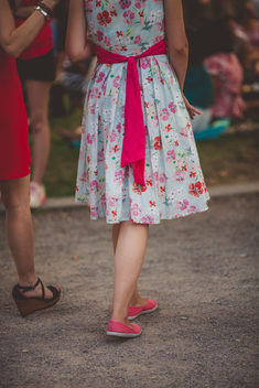 Two girls with vintage  colorful dresses walking